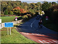 Village sign and road markings at entrance to Bwlch village