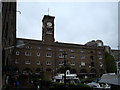 Shopping parade and clock tower in St Katharine Dock