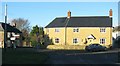 Yellow stone house by the road junction in Broadwindsor