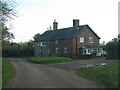 A pair of semi-detached houses by the road junction