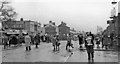 Crowds in Ormskirk Road outside Aintree Racecourse on a very wet Grand National Day