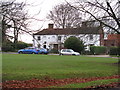 View across village green to Plaistow Stores