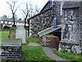 Church, headstones and shops on Upminster Road South