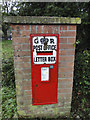 GR letterbox in a brick pillar