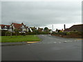 Looking across Alinora Crescent  into Brook Barn Way