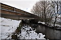 A bridge over the river Caen on Vellator Way as seen from upstream