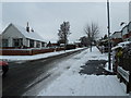 Junction of a snowy  Farlington Avenue and Solent Road