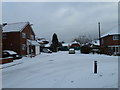 Junction of a snowy  Aldworth Close and Waverley Road