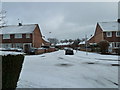 Crossroads of Central and Lealand Roads with a snowy Copsey Grove