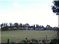 Bungalows in the Village Lane area seen across farmland