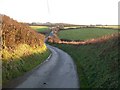 The Penycaerau Road descending to Pont Rhyd-llo bridge