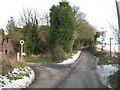 Lane junction near Venson Farm