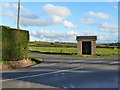 Bus shelter at junction of road to Kingcoed