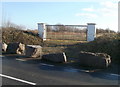 Rocks and gates barring access to empty field, St Bride