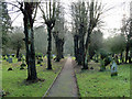 TQ3551 : Path, Godstone churchyard by Robin Webster