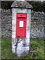 Benchmarked letter box on west side of Ladder Hill