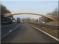 SJ9120 : M6 Motorway - footbridge near Moss Pit by Peter Whatley