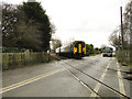 Passing over the level crossing at Rackheath