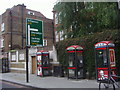 Phone boxes and road sign, Stoke Newington High Street