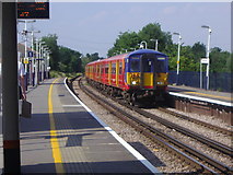 TQ2266 : Train at Worcester Park station by David Howard