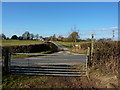 Gate, lane signpost and farm