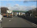 A550 bridged by the North Wales main railway line