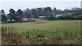 ST9570 : 2011 : Derry Hill Farm across a field by Maurice Pullin