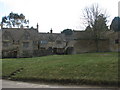 Cotswold stone houses by the green in Guiting Power