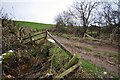 A track leaving Lower Metcombe Farm as seen from the downstream side of Knowl Water