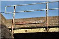 Old sign on bridge