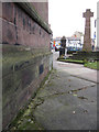 The church, the war memorial, and a bench mark, Neston