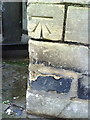 Benchmark on building at junction of Bridewell Lane and Saw Close