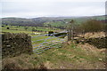 Two footpaths leaving the road above Briargrove Farm