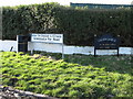 Road name sign at the junction of Greencastle Pier Road and Grange Road