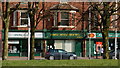 Shops and flats on Princess Road in Moss Side