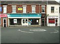 Rowlands Chemists with a mini-roundabout in front