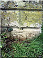 Benchmark on gatepost at entrance to The Lawn