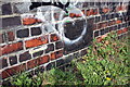 Benchmark on wall of railway bridge near Roger Dudman Way