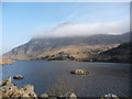 SH6560 : The western end of Llyn Ogwen with Tryfan mantled behind by Jeremy Bolwell