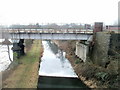 Track along narrow strip of land between canal and river, Neath