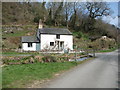 Pretty cottage beside ODP with a planning notice on its gate