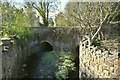 A bridge on an old section of the B3233 near Combrew as seen from upstream