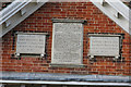 Three plaques over the doorway