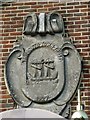 Coat of arms on a pier side caf