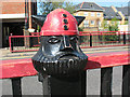 Painted head on Penwith Road bridge