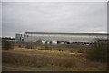 TL1996 : Large warehouse by the East Coast Main Line by N Chadwick
