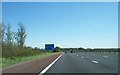 Information board and footbridge near Barton on M6