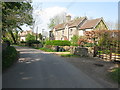 Houses along the road through Chedglow