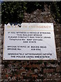 TM3356 : Sign on the Bucks Head Railway Bridge by Geographer