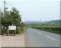SO4208 : Monmouth Road passes Crown Farm near Raglan by Jaggery